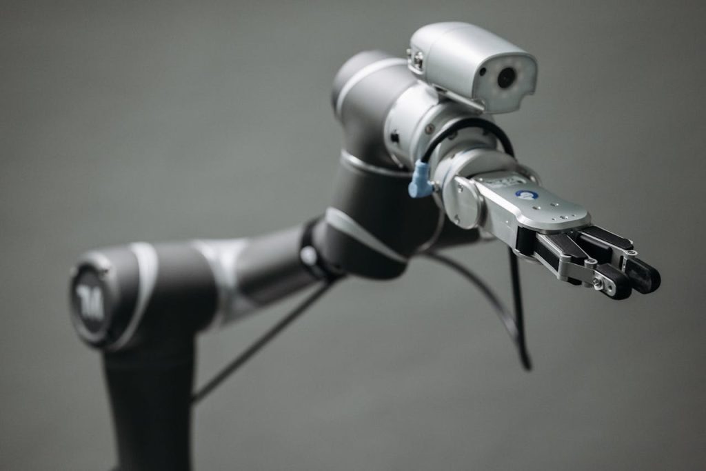 Close-up view of a robotic arm equipped with a video camera, showcasing modern technology.
